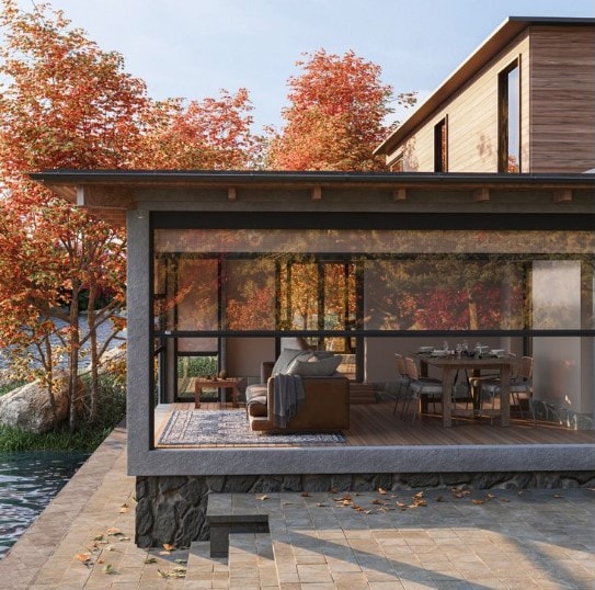 Pergola con tende Delta Double Zip trasparenti in un giardino autunnale